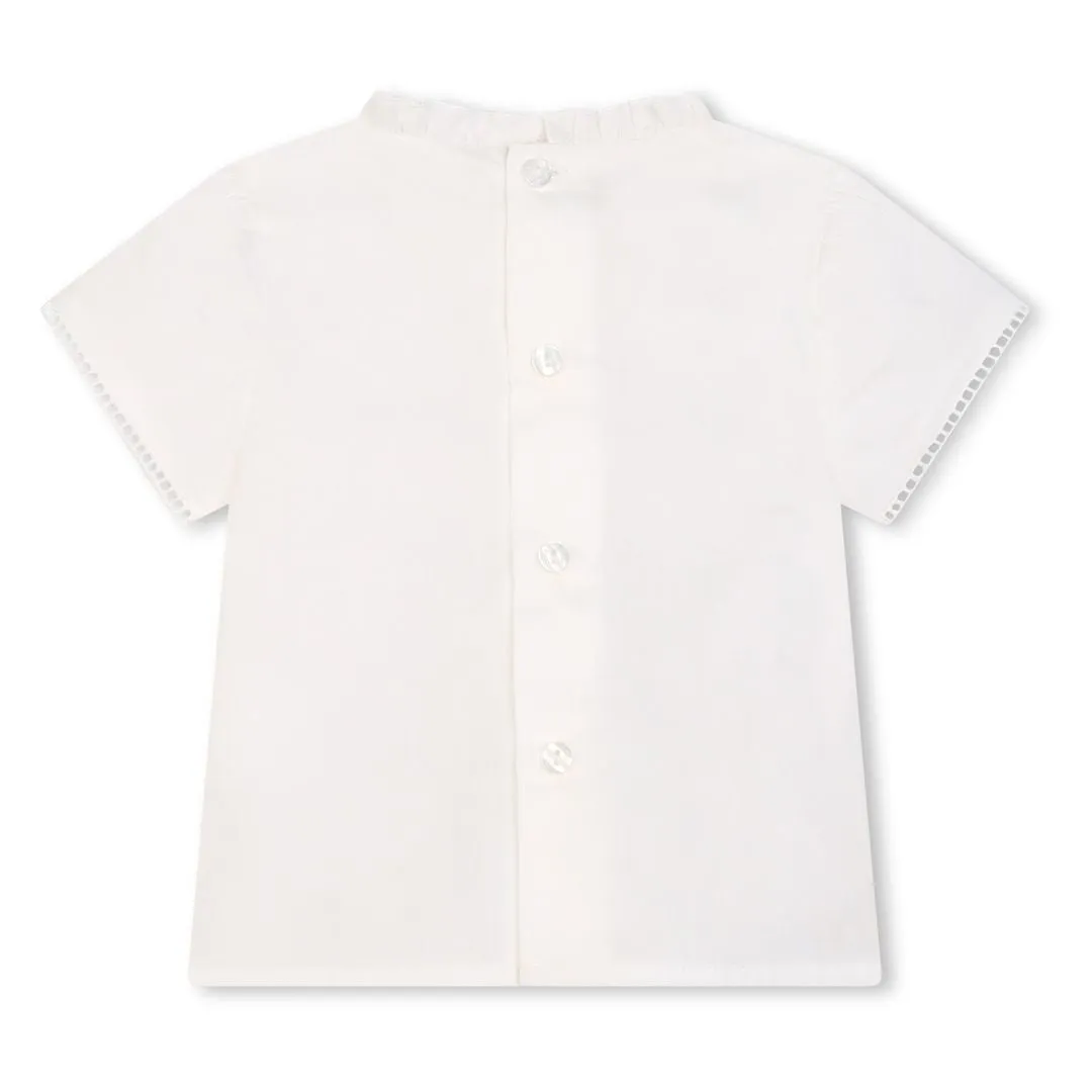 White Ruffle Blouse and Blue Shorts